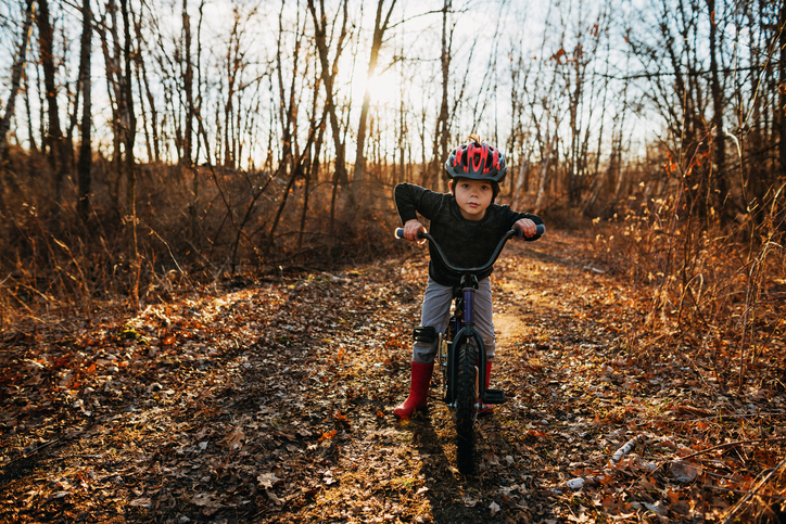 Child learning to ride a bike 